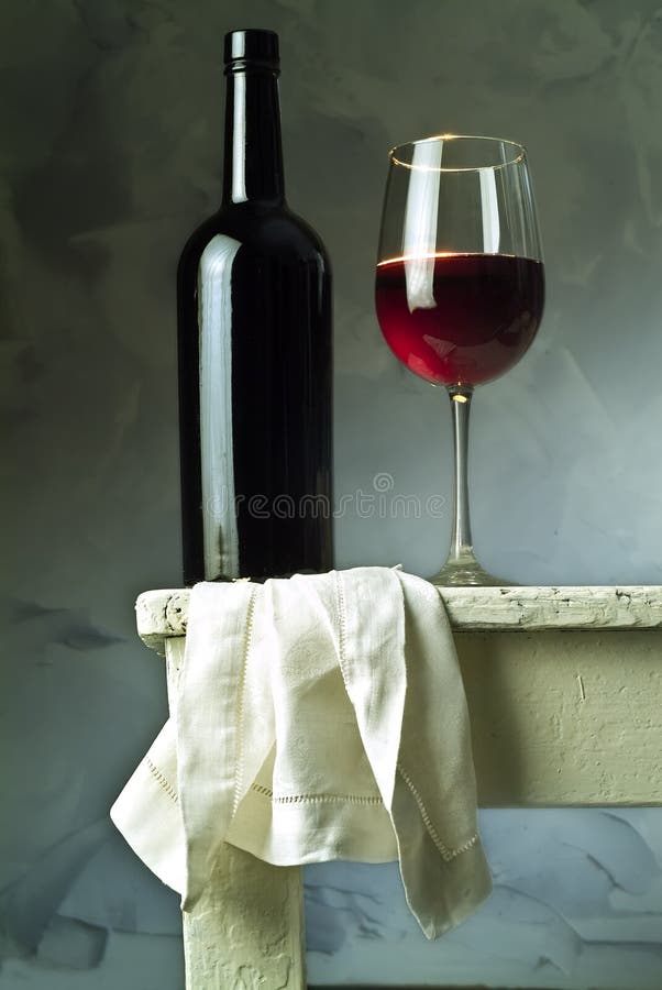 Red wine glass and bottle