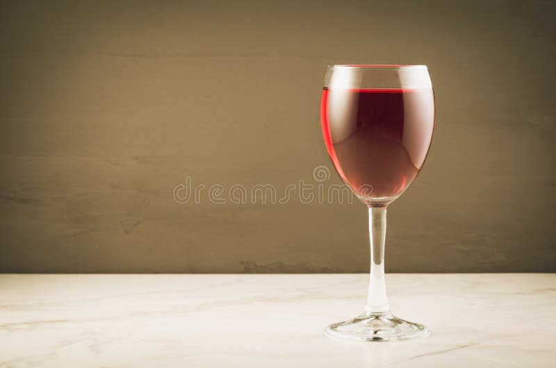 Red Wine Glass on a Brown Background/red Wine Glass on a Brown