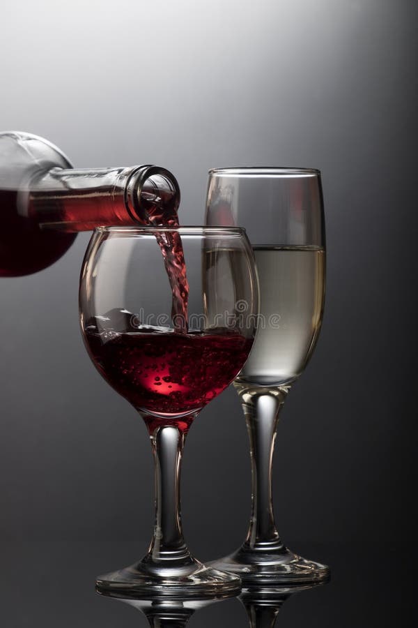 Red wine glass pouring stock image. Image of pouring 69355003