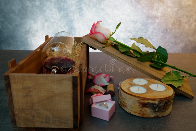 Red wine glass with rose flower on concrete table. royalty free stock image Red wine glass with rose flower on concrete table. royalty free stock image