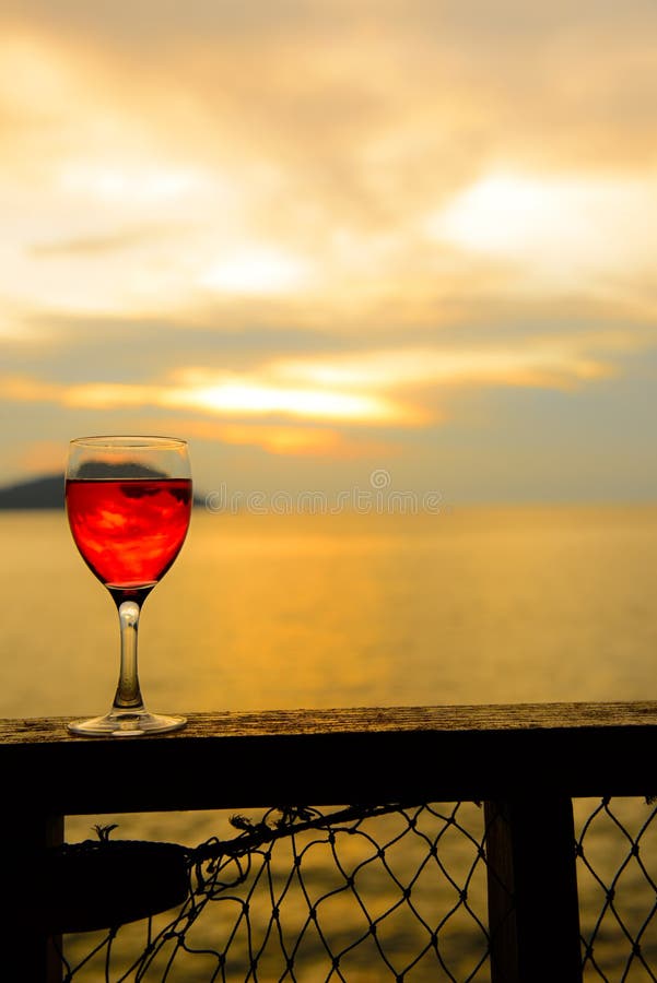 Red wine glass at sunset stock photo. Image of travel 30459572