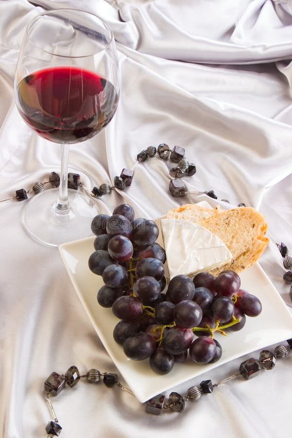 Red wine, grapes and cheese