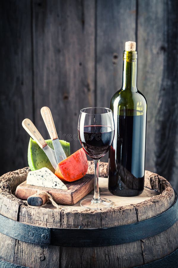 Red Wine and Mix of Cheese on Barrel. Wine Industry Stock Photo Image