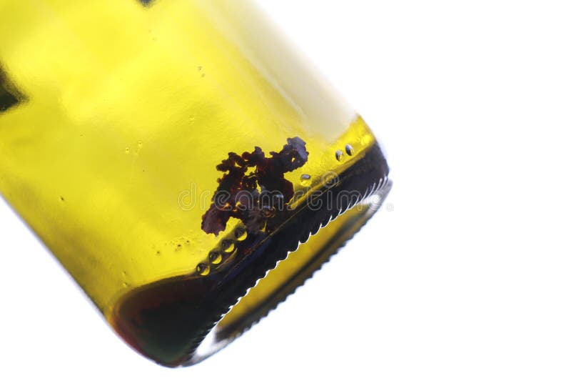 Red Wine Tartrate Crystals at the Bottom of an Empty Wine Bottle Stock
