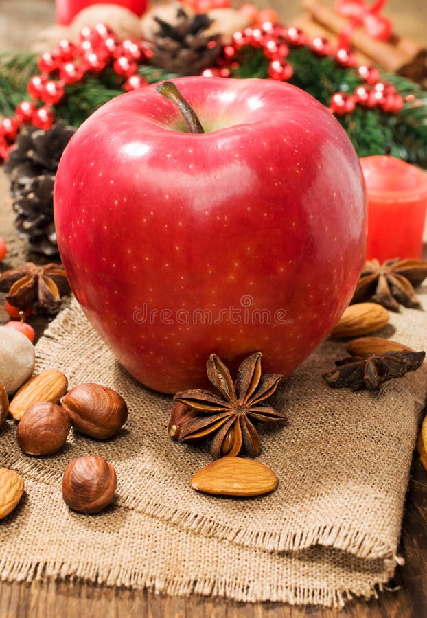 Red winter apple with nuts and star anise