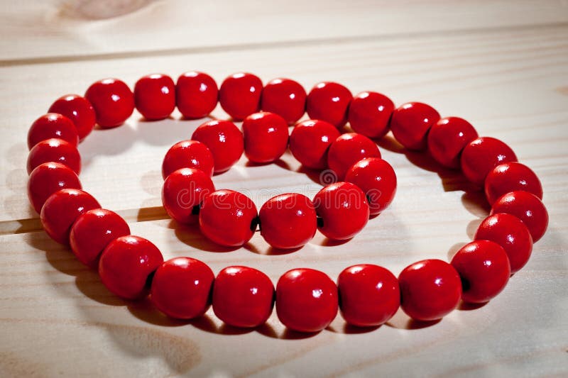 Red Wooden Beads and Bracelet on a Wooden Background Stock Image - Image of  bright, macro: 112335121