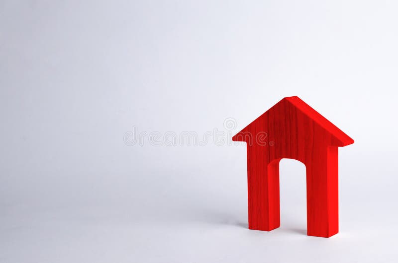 Red wooden house with a large doorway on a white background. The concept of buying and selling real estate, rental housing.