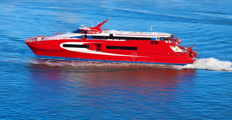 Red yacht with motion blur stock image