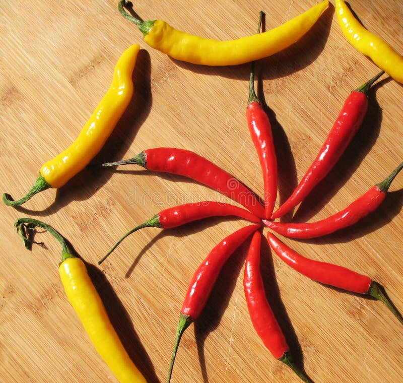 Red and Yellow Chili Peppers. Stock Photo Image of yellow, radial