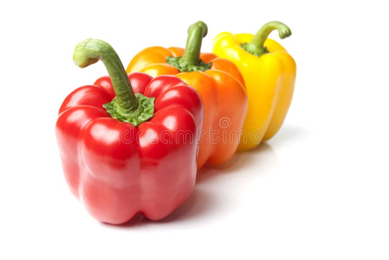 Red Yellow and Orange Bell Peppers on Isolated Whi