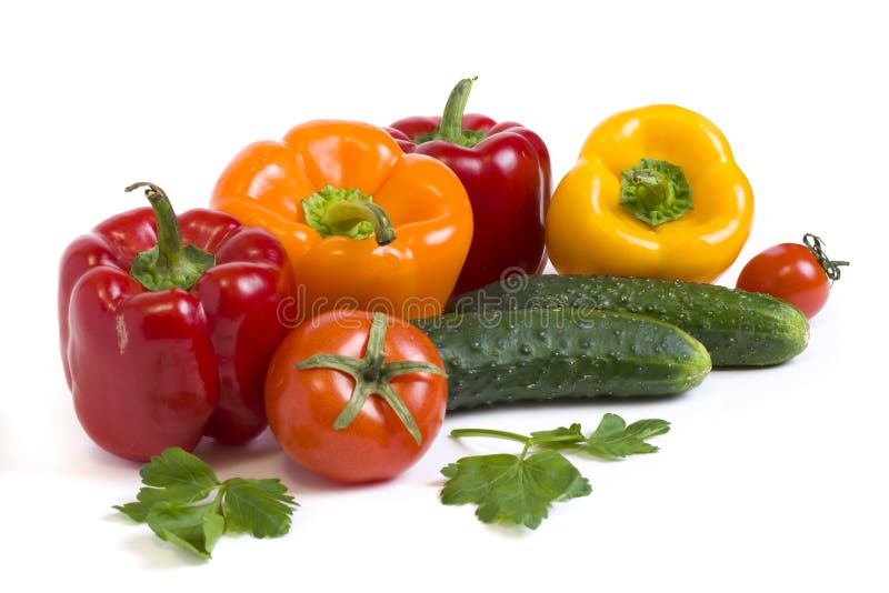 Red Yellow and Orange Peppers with Tomatoes on a White Background ...