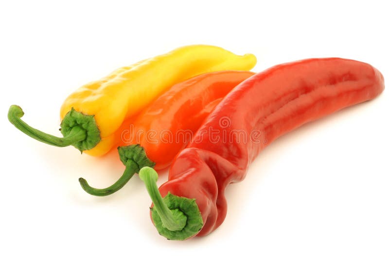 Red,yellow and orange sweet pepper (capsicum) on a white background