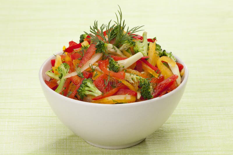 Red, yellow and orange sweet pepper, broccoli and fennel salad