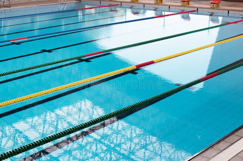 Red yellow rope lane of light reflection blue swimming pool for sport competition background