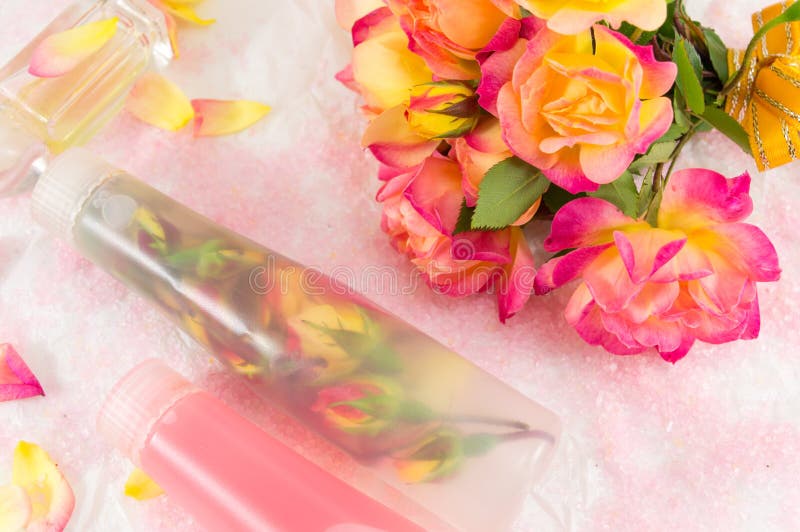 Red and Yellow Roses with Rose Massage Oil Stock Photo Image of