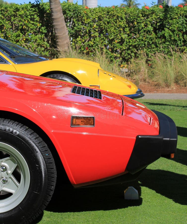 1960s and 1970s Italian sports car line up red and yellow at cavallino concorso deleganza west palm beach Ferrari 308 gt4 and dino 246 gt. 1960s and 1970s Italian sports car line up red and yellow at cavallino concorso deleganza west palm beach Ferrari 308 gt4 and dino 246 gt