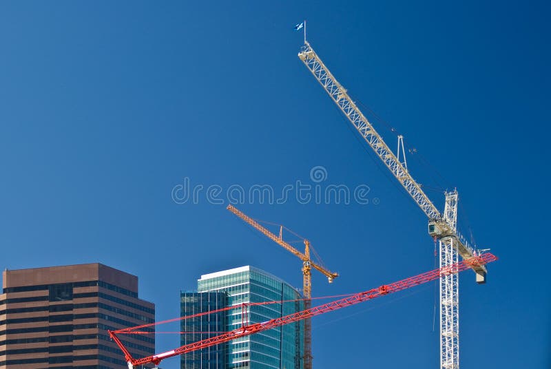 Red, yellow and white cranes