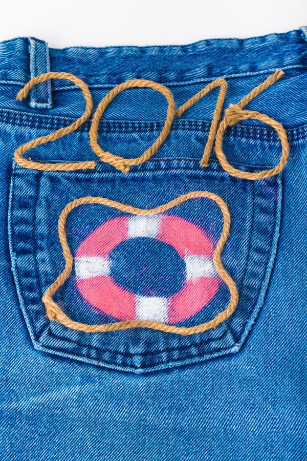 Lifebuoy and rope number 2016 on jeans pocket background. Toned. Lifebuoy and rope number 2016 on jeans pocket background. Toned.