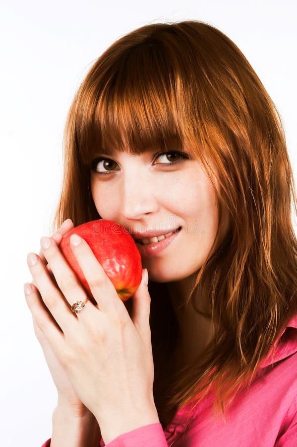 Redhair girl with apple stock photo. Image of facetious 10809598