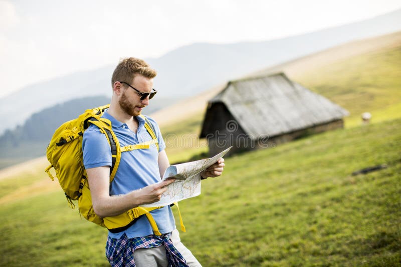 Redhair Man on Mountain Hiking Holding a Map Stock Photo - Image of ...