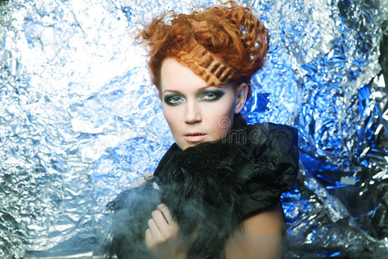 Redhair woman on silver background stock photo
