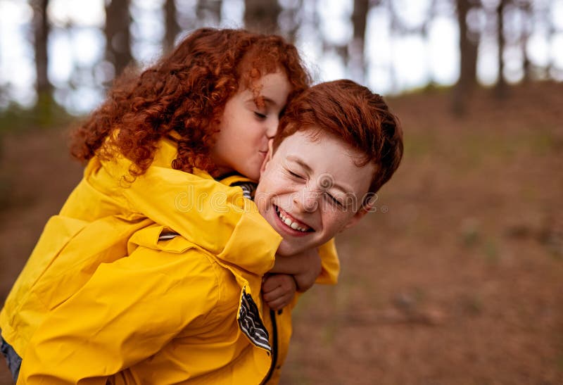 800px x 547px - Redhead Girl Hugging and Kissing Brother Stock Photo - Image of girl, play:  197130170