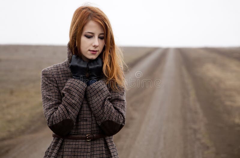 Redhead girl at the road.