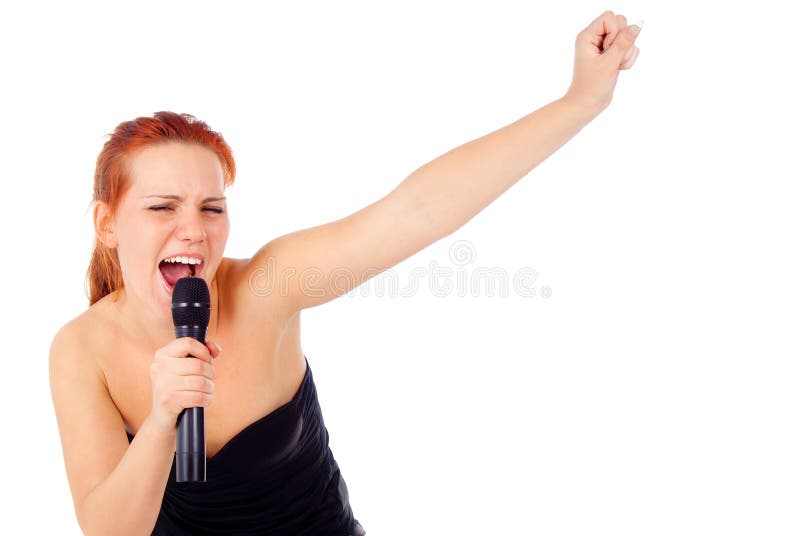 Redhead girl sings into a microphone