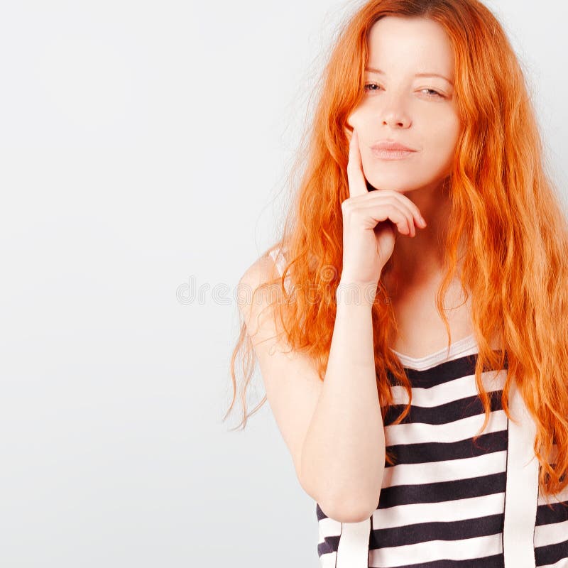 Redhead Girl Squints And Frowns Doubt Choice And Suspicion Stock