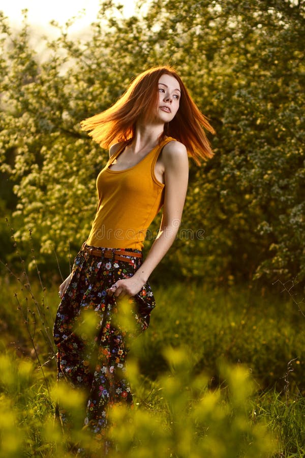 Redhead Girl Walking Under Sunset Rays In Forest Stock Image Image Of