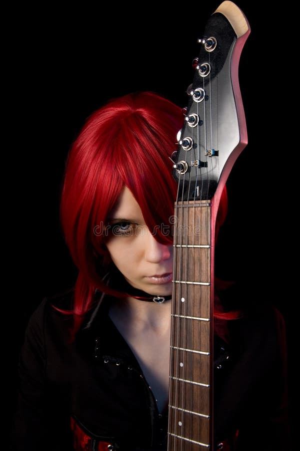 Redhead gothic girl with guitar royalty free stock photos