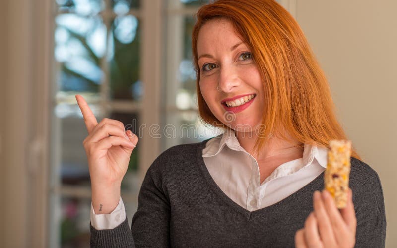Young beautiful redhead woman at home stock photography Young beautiful redhead woman at home stock photography