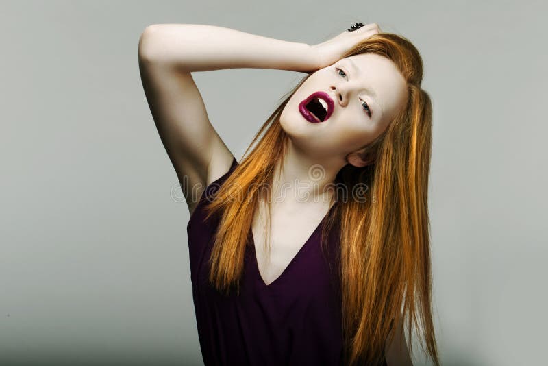 Shock. Neurotic Unhappy Red Head Woman Pulling Her Hair in Frustration. Scream