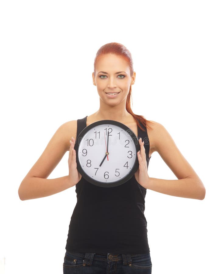 A redhead woman showing the time on the clock