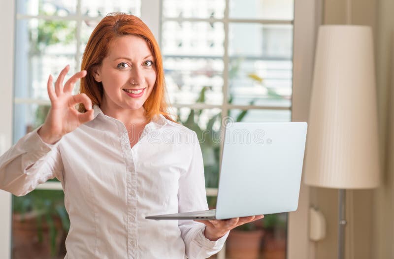 Young beautiful redhead woman at home stock photography Young beautiful redhead woman at home stock photography
