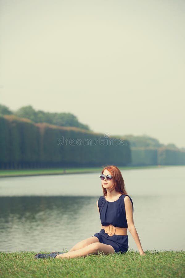 Redhead women near lake