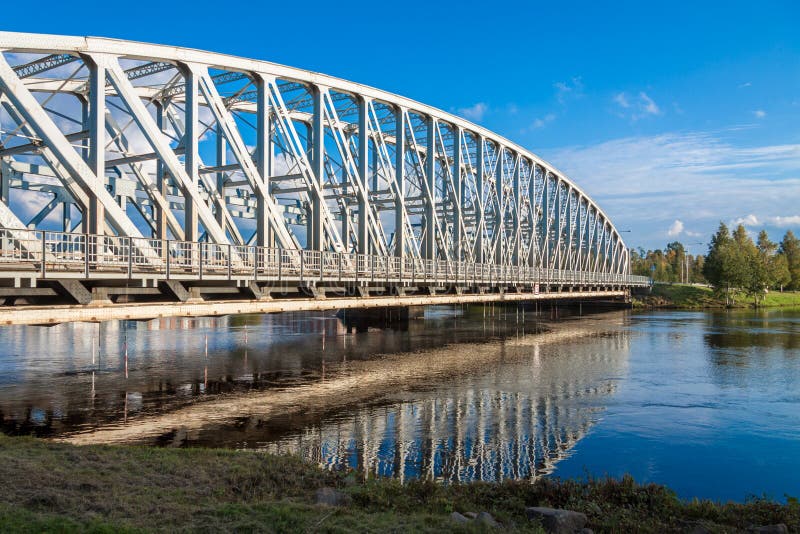 Refection of bridge upon the river in Finland