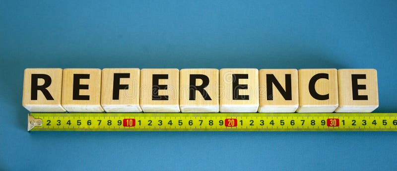 Reference Symbol. Reference Word on Cubes Arranged Behind the Ruler on ...