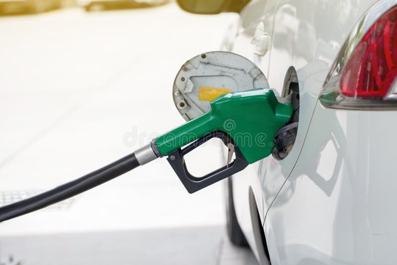 Refill and filling Oil Gas Fuel at station.Gas station - refueling.To fill the machine with fuel. Car fill with gasoline at a gas royalty free stock photos Refill and filling Oil Gas Fuel at station.Gas station - refueling.To fill the machine with fuel. Car fill with gasoline at a gas royalty free stock photos