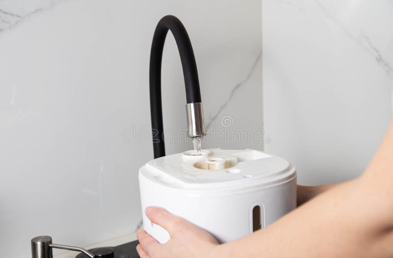 Refilling the Air Freshener Container with Tap Water. Air Freshener