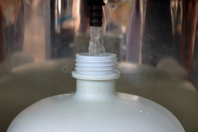 Refilling a Plastic Water Bottle from a Vending Machine, Shallow Depth