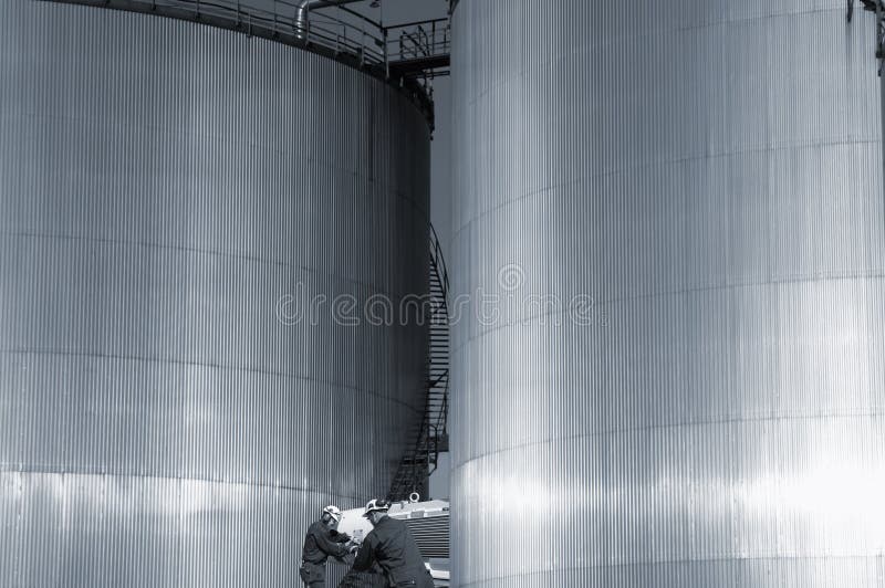 Download Refinery Fuel- Towers And Engineers Stock Photo - Image of industry, gasoline: 22666246