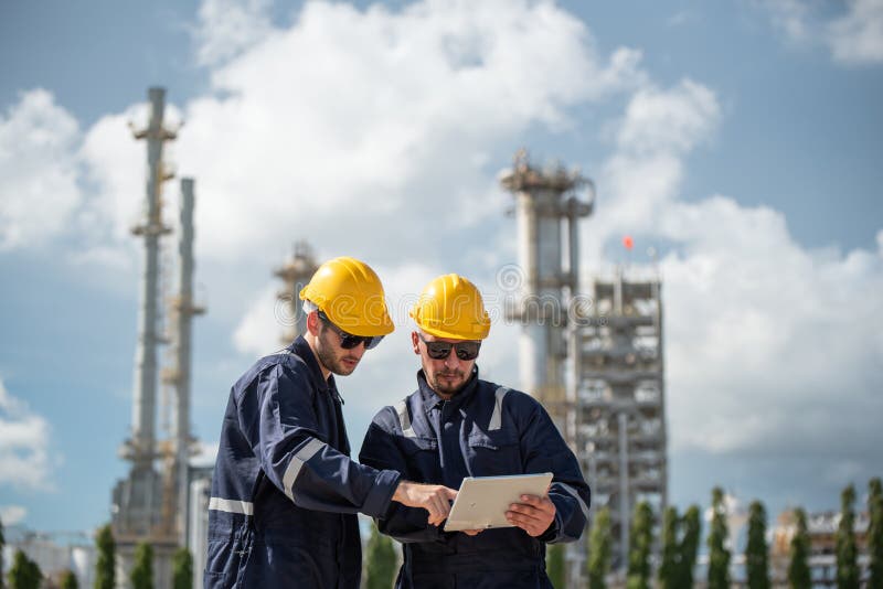 Refinery industry, engineer working in industrial production, oil and gas refinery plant industry factory royalty free stock image
