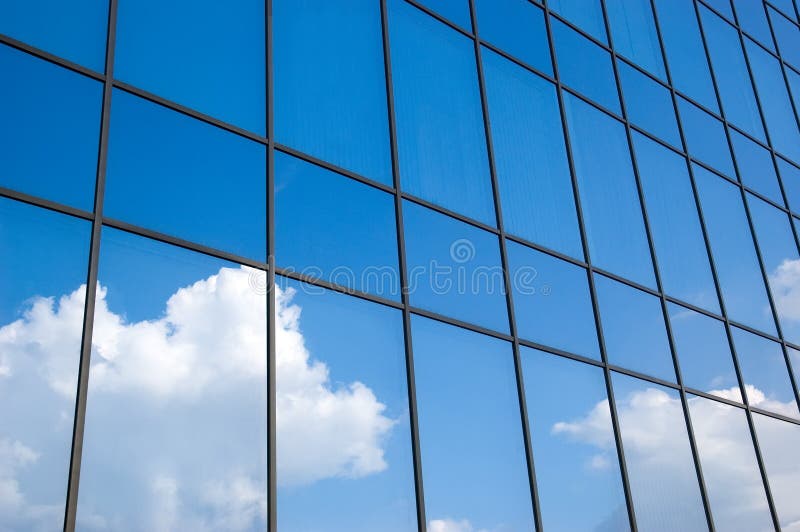 Reflection of a cloudy sky in glass wall