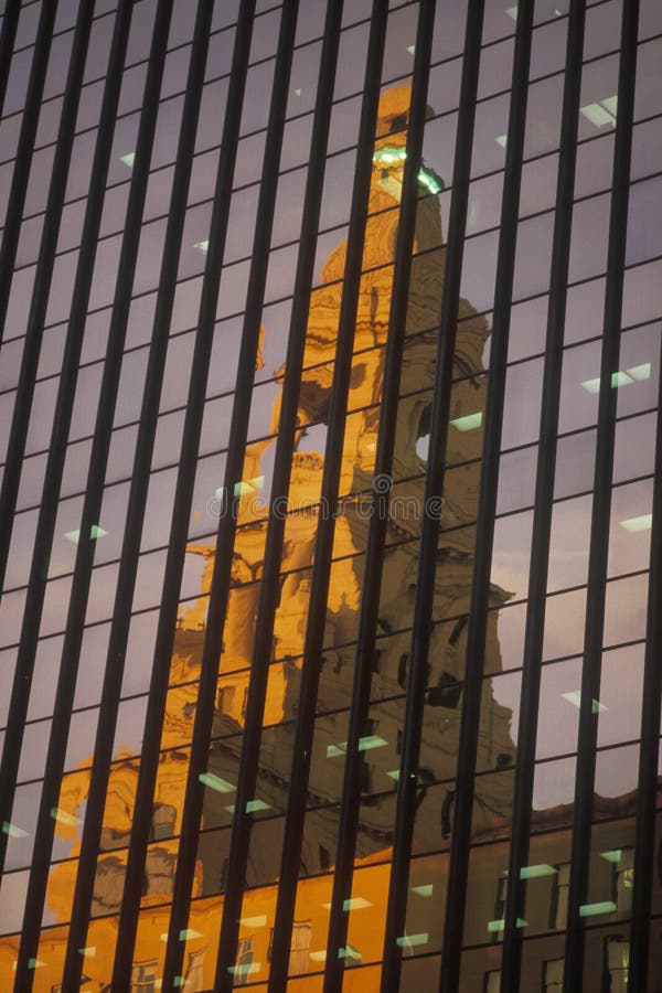 Reflection of the courthouse in building window