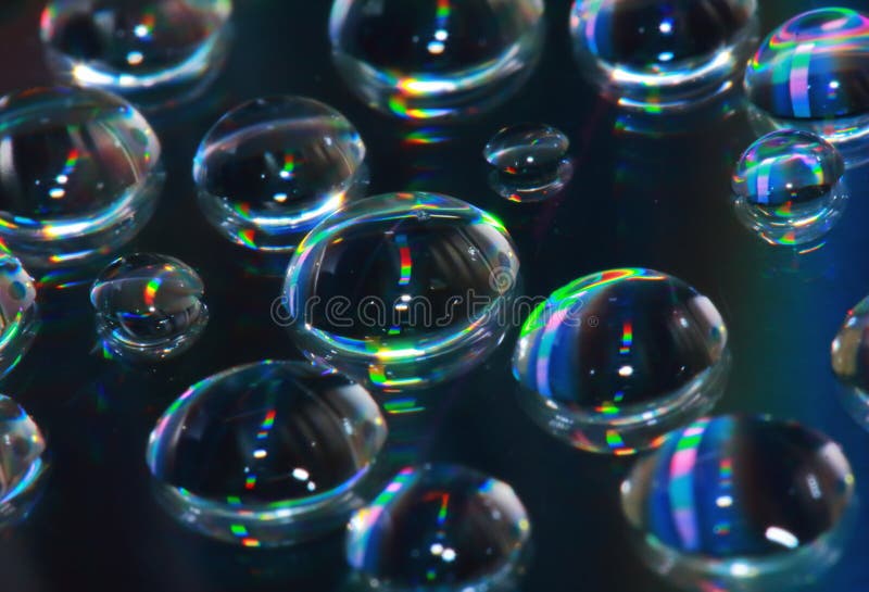 Reflection of dropet on cd in macro for background royalty free stock photo