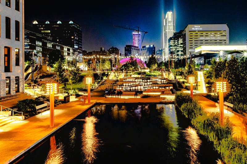 The Reflection pool at the Riverfront at night downtown Omaha Nebraska USA