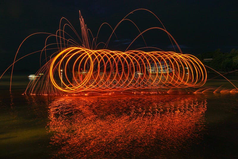 Reflection of Spark Fire Swirl from Steel Wool with Long Exposure Speed