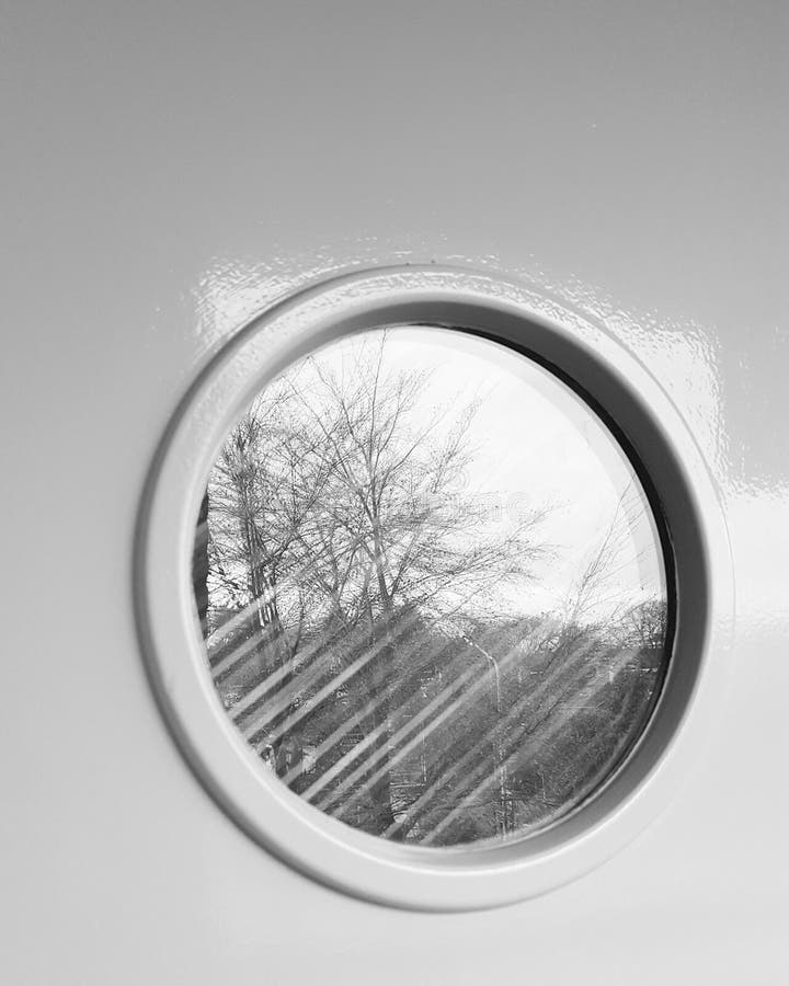 A round window reflecting trees and buildings in its surrounding. Dukenburg stock images, royalty-free photos and pictures