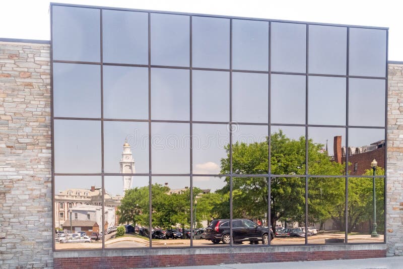 Reflections on glass side of building of city hall and downtown area Schenectady New York